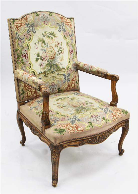 A Louis XVI style walnut open armchair,